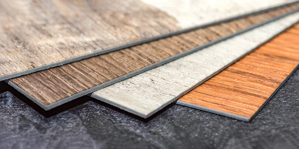 PVC vinyl floor. Samples of vinyl flooring. Collection of vinyl tiles. DIY home items — Stock Photo, Image