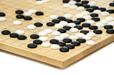 Goban, Baduk, Weiqi veya Maklom - Geleneksel Asya stratejisi oyunu. Çin masa oyununun siyah beyaz taşı