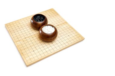 Goban, Baduk, Weiqi veya Maklom - Geleneksel Asya stratejisi oyunu. Çin masa oyununun siyah beyaz taşı