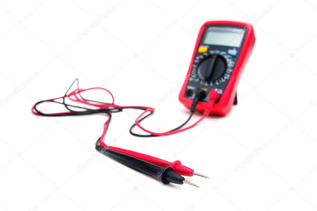 Red digital multimeter with probes on white background - Multimeter is an electronic measuring instrument for voltage, amper, resistance