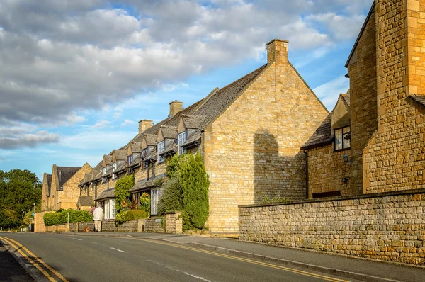 Empty road with limestone cottages — Stock Photo, Image