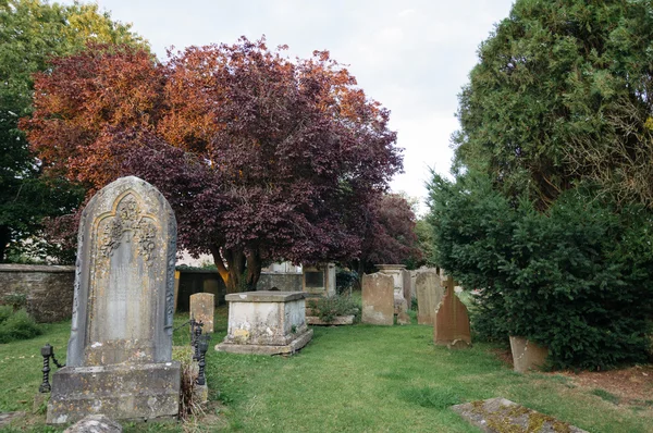 Churchyard at sunset — Stock Photo, Image