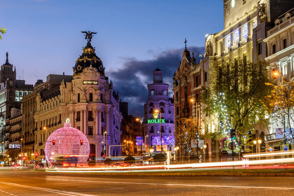 Madrid, Spain - December 6, 2020: Alcala Street and Gran Via in Madrid illuminated at Christmas with LED lights