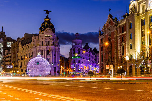 Madrid, Spain - December 6, 2020: Alcala Street and Gran Via in Madrid illuminated at Christmas with LED lights