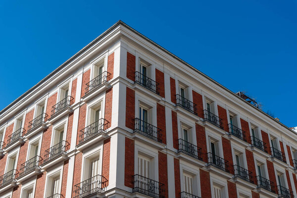 Old luxury residential buildings with balconies in historic centre of Madrid. Concept rent regulation and real estate