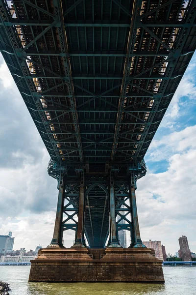Iconic View Under Manhattan Bridge Against Cityscape of New York City — стокове фото