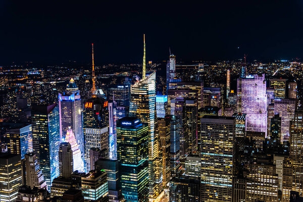 New York City, USA - June 25, 2018: High angle view of the skyline of Manhattan at night. Business, technology and travel backgrounds