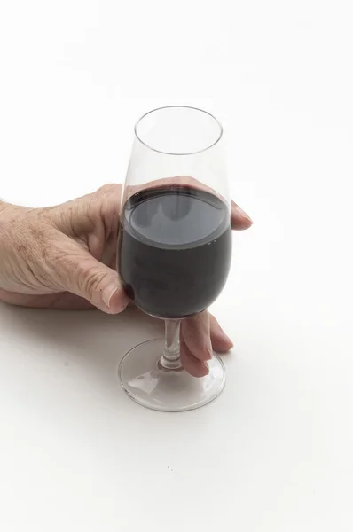 Old woman hand holding a glass of wine — Stock Photo, Image