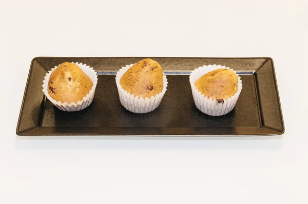 Home made muffins isolated on a table — Stock Photo, Image