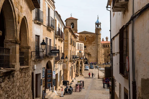 Trujillo, Spain - October 18, 2022: A picturesque street in Trujillo, Extremadura, Spain, featuring historical architecture and a view towards a church.