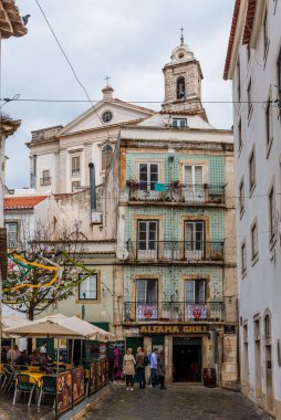 Lisbon, Portugal - October 29, 2022: Picturesque buildings in the Alfama district of Lisbon, Portugal, showcasing traditional architecture.