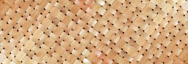 Hasır sepet ya da dokuma sepetinin deseni ve deseni bambu desenli, elle örülmüş, bambu dokuma desenli, doğal sarımsı renklerle bezenmiş arka planlar. uygulanabilir arkaplan afişi, duvar kağıdı.