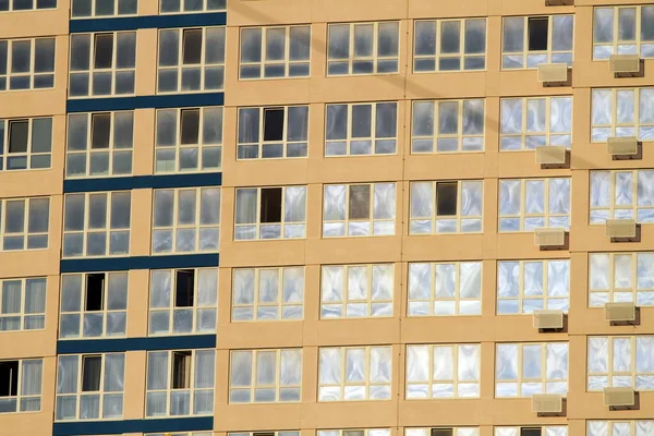 new windows on the facade of a high-rise building