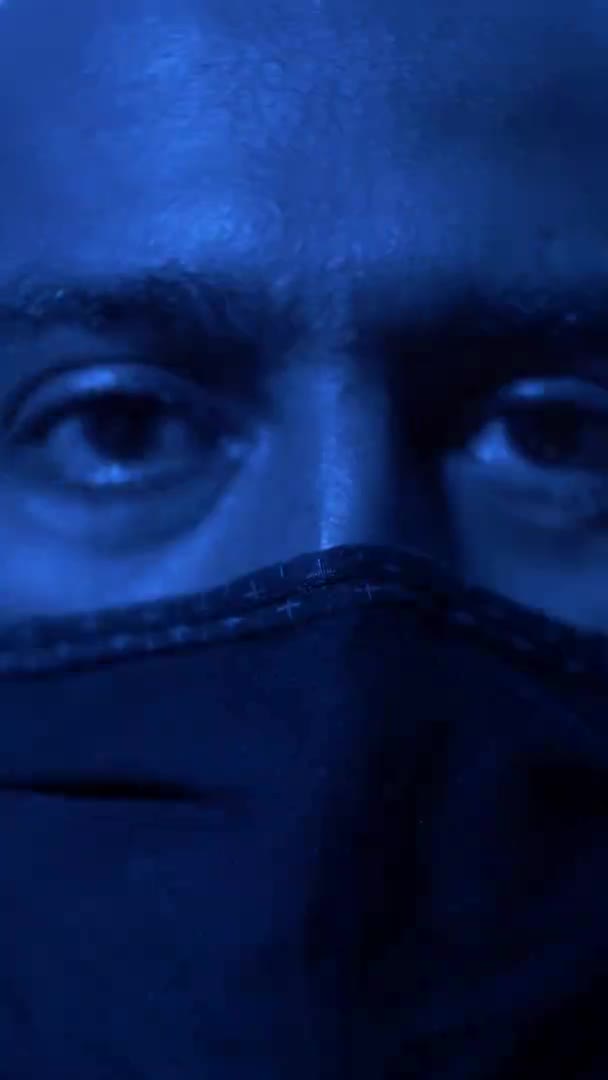 Adult Male Wearing Face Mask Red Blue Strobe Lighting Vertical — Vídeos de Stock