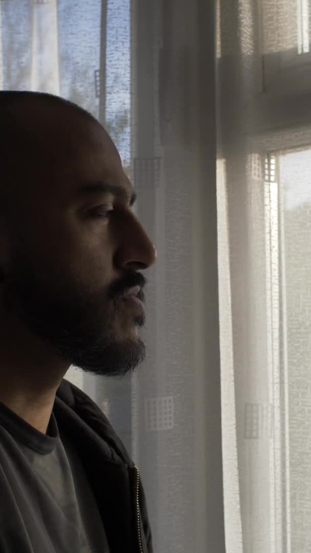 Bald Male Indoors Looking Out Window Lockdown Dalam Ruangan Video — Stok Video