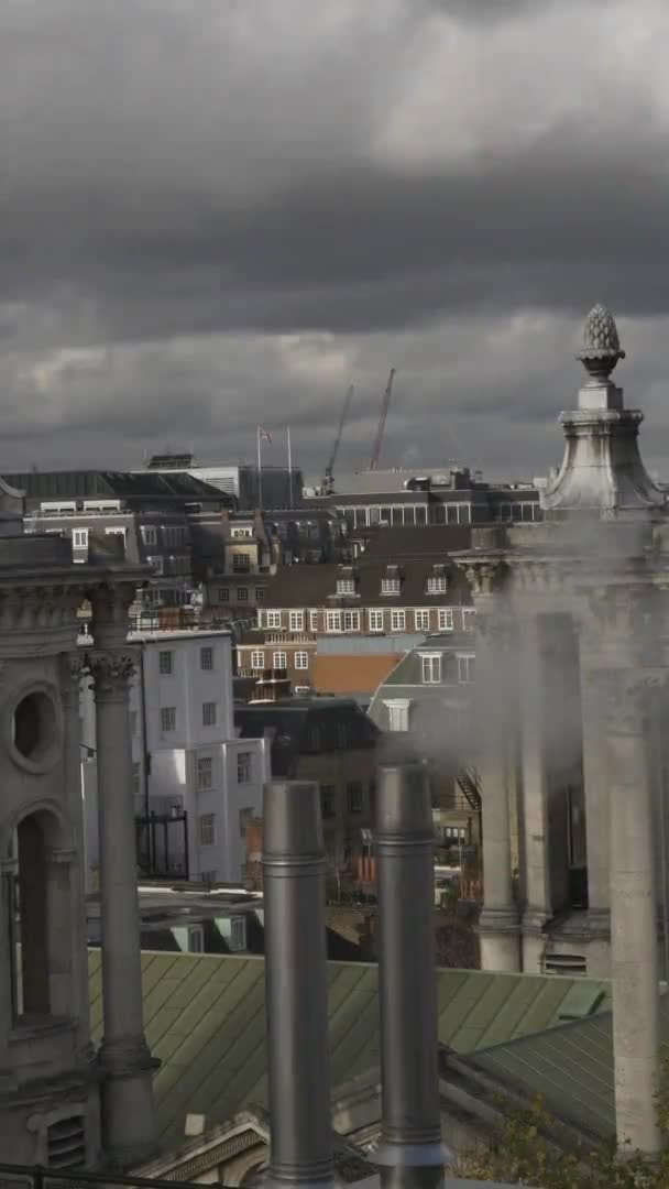 View Of Ventilation Pipes and Flue Terminals On Rooftop In London. Vertical Video, Locked Off — Stock Footage View Ventilation Pipes Flue Terminals Rooftop London Vertical Video Locked Stock Video