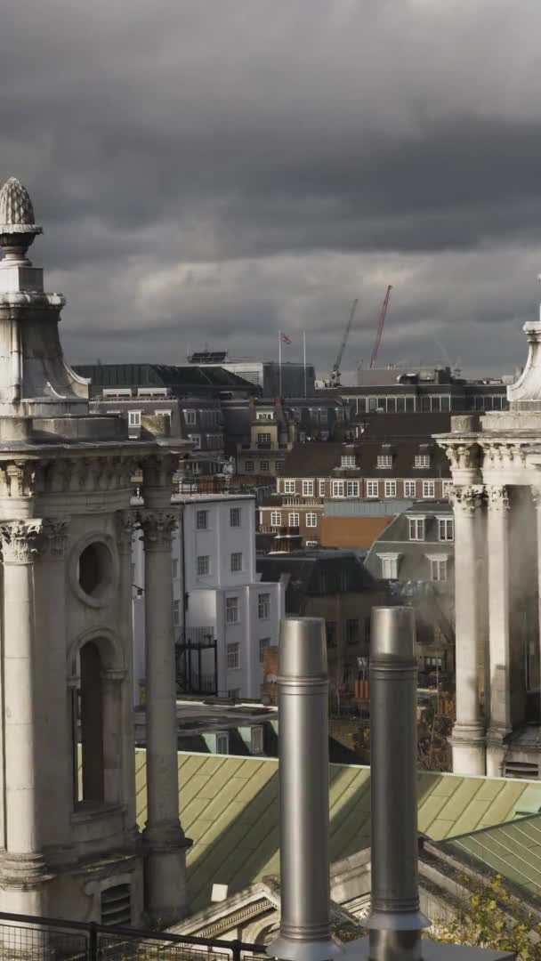 London Rooftop View Of Ventilation Pipes and Flue Terminals. Vertical Video, Locked Off — Stock Footage London Rooftop View Ventilation Pipes Flue Terminals Vertical Video Locked Royalty Free Stock Footage