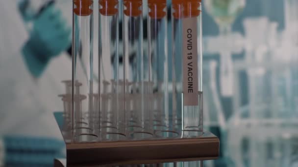 Coronavirus Covid Vaccine Test Tube Vials Being Placed Rack Close — Stock video