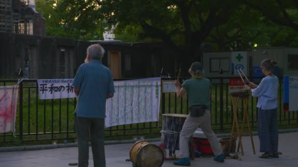 Activists Drumming Hiroshima Peace Dome Locked — Stock Video