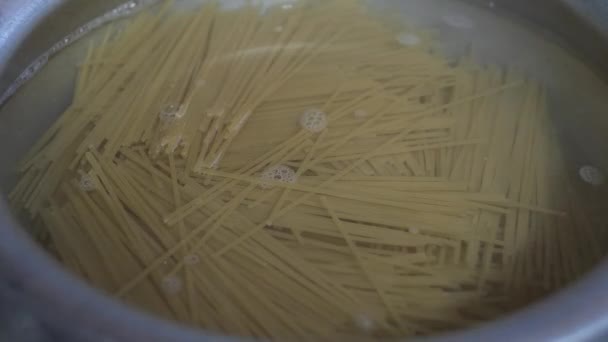 Broken Spaghetti Simmering Hot Water Cooking Pot Locked Close — Stock Video