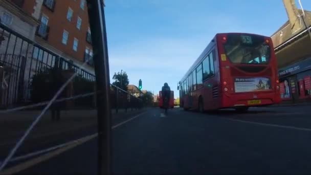 Low Angle Pov Cycling Park Way Road Red Bus Turning — Stock video