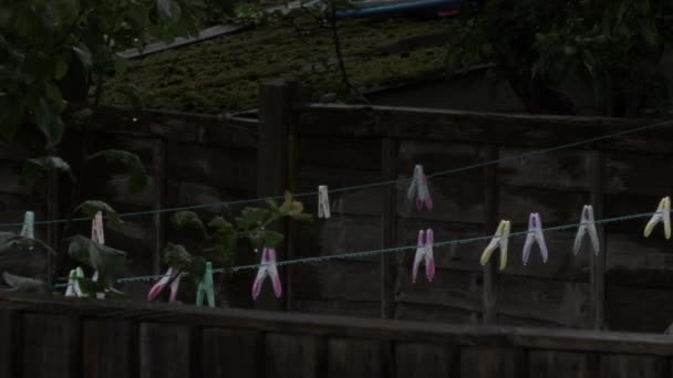 Wet Clothes Pegs Hanging Garden Overcast Day Locked — Wideo stockowe