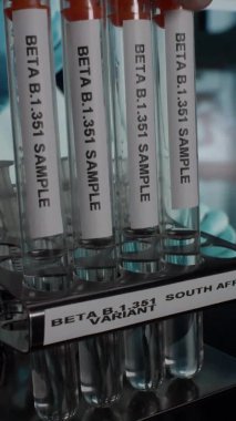 Beta B.1.351 South Africa Variant Test Tube Vials Being Taken Off From Rack. Vertical Video, Locked Off