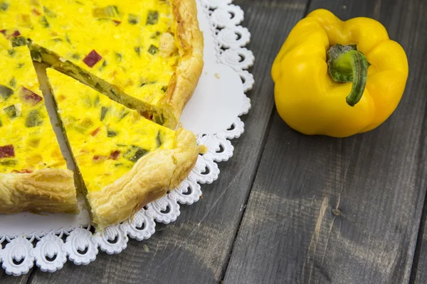 Savory pie with peppers, onion, carrots and zucchini