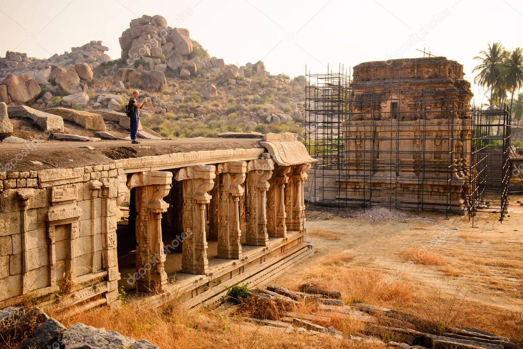 Tourist explore and take photo of temple Hampi ancient temples, Karnataka, India