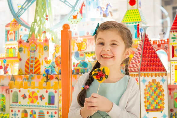 Beautiful hamming girl with lollipop in hands — Stock Photo, Image