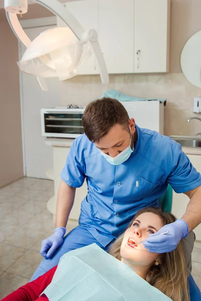 Woman having teeth examined at dentist — Stock Photo, Image