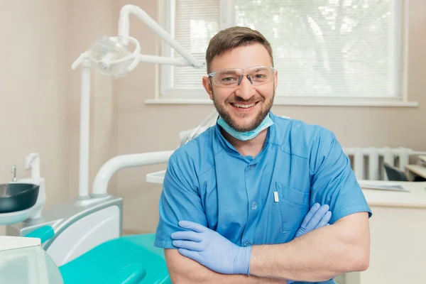 Portrait of friendly dentist in the dental office — Stock Photo, Image