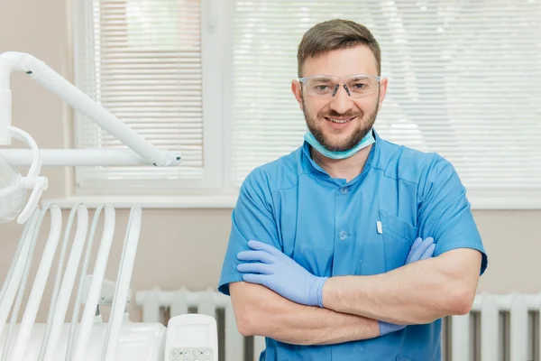 Portrait of smiling dentist in the dental office — Stock Photo, Image