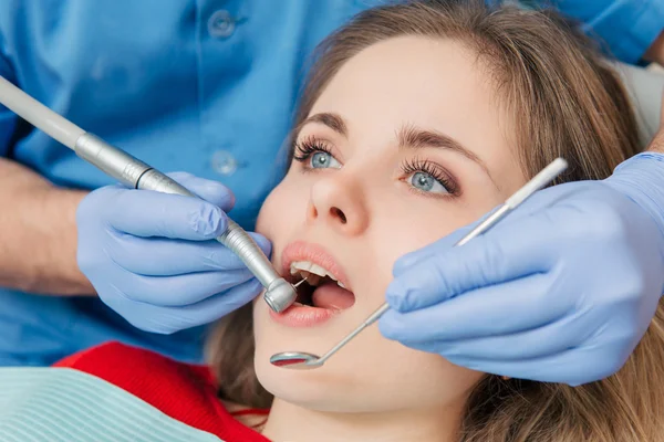 Woman having teeth examined at the dentist Stock Image