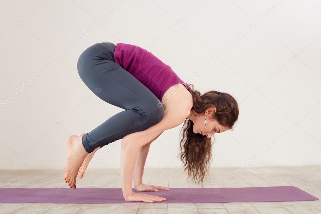 Young woman doing yoga exercises