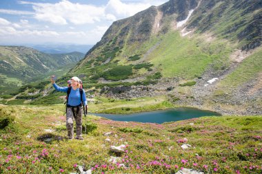Happy woman making selfie in the mountains