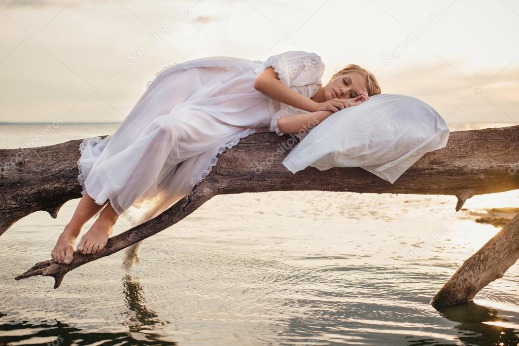 Romantic blonde woman sleeping on the fresh air 