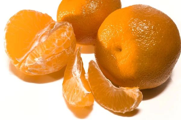 Tangerines and segments — Stock Photo, Image