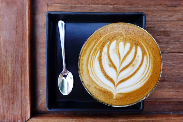 Cup of latte art coffee — Stock Photo, Image