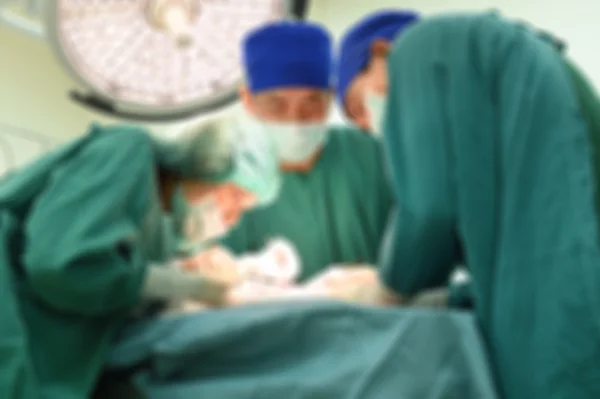 Unschärfe der Gruppe von Tierärzten im Operationssaal — Stockfoto