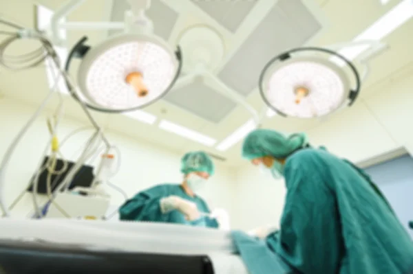 Blur of two veterinarian surgeons in operating room — Stock Photo, Image
