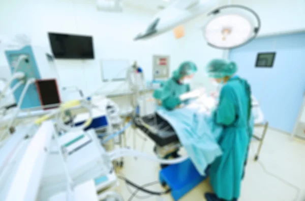 Blur of two veterinarian surgeons in operating room — Stock Photo, Image