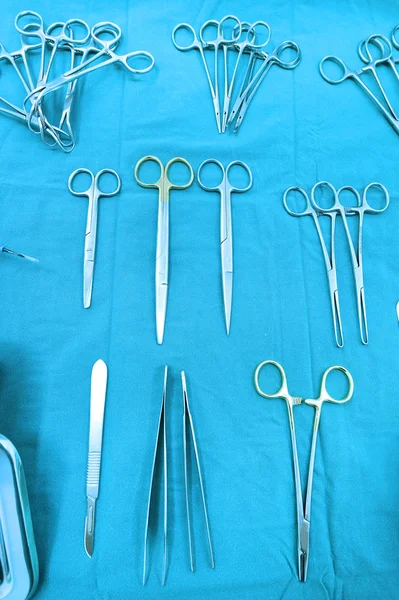 Detail shot of steralized surgery instruments with a hand grabbing a tool — Stock Photo, Image