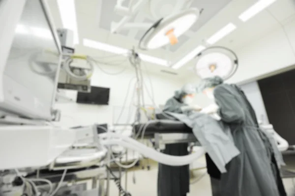 Blur of two veterinarian surgeons in operating room — Stock Photo, Image