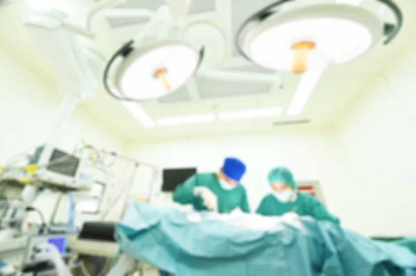 Blur of two veterinarian surgeons in operating room — Stock Photo, Image