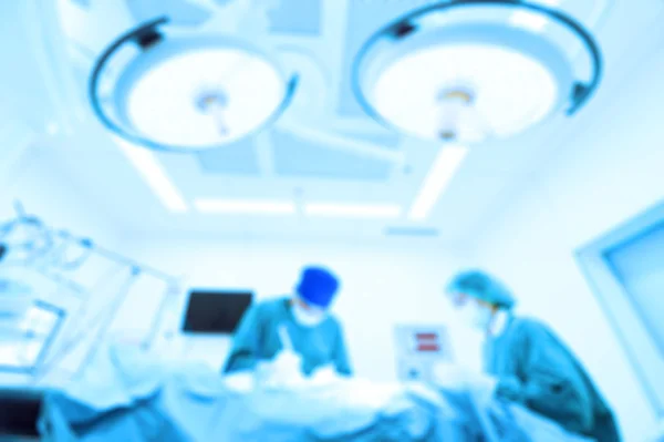 Blur of two veterinarian surgeons in operating room — Stock Photo, Image