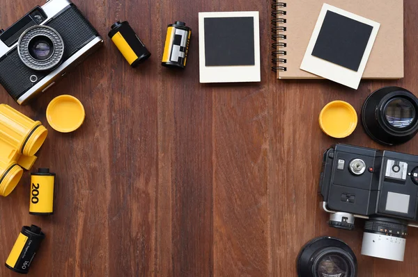 Blank notebook with photo film, photo frames and camera — Stock Photo, Image