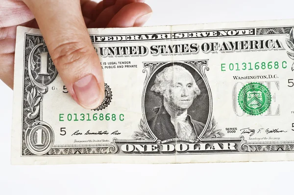 Uma nota de um dólar na mão — Fotografia de Stock