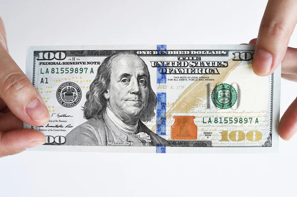 One hundred dollar bill on hand — Stock Photo, Image