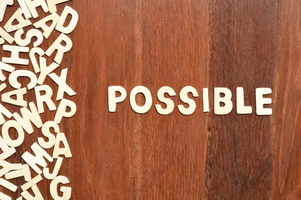 Word possible made with block wooden letters — Stock Photo, Image